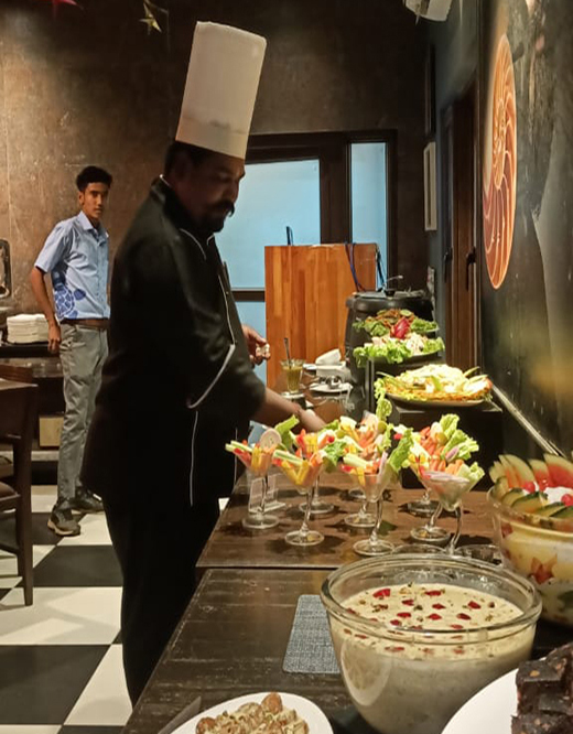 Chef arraning fruit table
